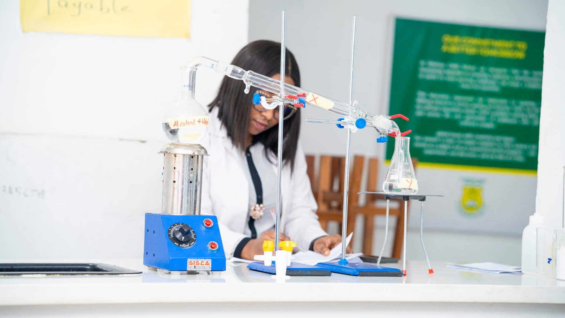 GCSL student running a distillation experiment in the science laboratory